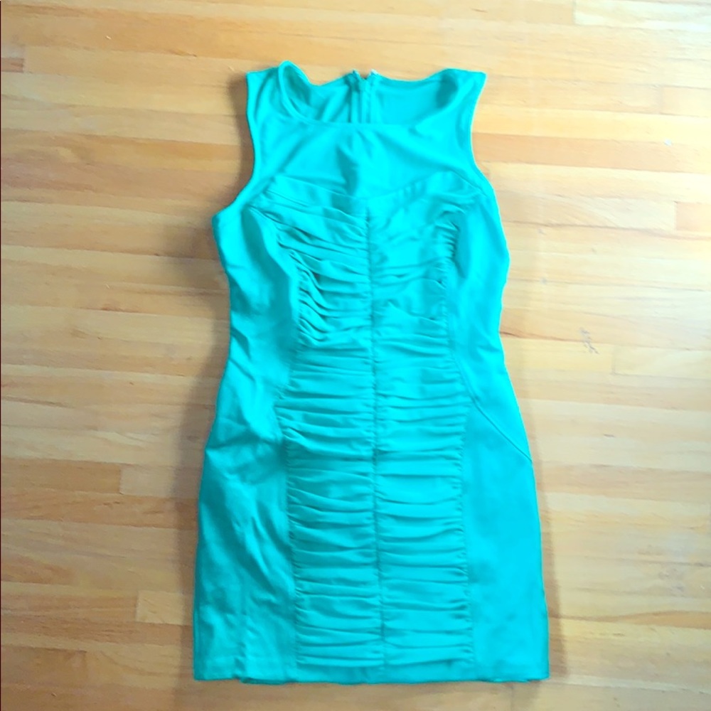Curve hugging Green Rouched BEBE dress size M EUC